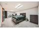 Spacious bedroom with neutral carpet, equipped with a desk, dresser and modern style accents at 2061 S Worchester Way, Aurora, CO 80014
