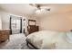 Cozy bedroom featuring soft carpet, plenty of natural light and ceiling fan at 2061 S Worchester Way, Aurora, CO 80014