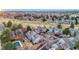 Aerial view of the community with a mix of townhomes, green spaces, and a pool at 2061 S Worchester Way, Aurora, CO 80014