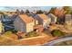 Aerial view of townhomes featuring well-maintained landscaping with mature trees and shrubs at 2061 S Worchester Way, Aurora, CO 80014