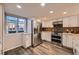 Bright and airy kitchen with stainless steel appliances and window overlooking the surrounding landscape at 2061 S Worchester Way, Aurora, CO 80014