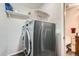 Updated laundry room with modern washer and dryer and extra storage space at 2061 S Worchester Way, Aurora, CO 80014