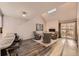 Bright living room features a vaulted ceiling, fireplace, skylight and sliding glass doors to the outside at 2061 S Worchester Way, Aurora, CO 80014
