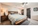 Comfortable main bedroom with ceiling fan, soft carpet and bedside lamps at 2061 S Worchester Way, Aurora, CO 80014