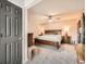 Spacious main bedroom with ceiling fan, carpet and an ensuite bathroom at 2061 S Worchester Way, Aurora, CO 80014