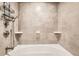 Modern shower with gray tiled walls and a sleek design, creating a spa-like experience at 2061 S Worchester Way, Aurora, CO 80014