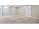 Spacious basement area with neutral carpet, paneled walls, recessed lighting, and access to additional rooms at 1475 S Eaton St, Lakewood, CO 80232