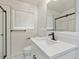 Stylish bathroom with modern fixtures, a sleek vanity, and a glass-enclosed shower at 1475 S Eaton St, Lakewood, CO 80232