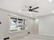 Bright living room with wood flooring, large window, and ceiling fan at 1475 S Eaton St, Lakewood, CO 80232