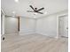 Bright living room featuring hardwood floors, recessed lighting, and a modern ceiling fan at 1475 S Eaton St, Lakewood, CO 80232