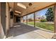 Spacious covered back patio perfect for outdoor dining and entertaining at 5448 S Swadley Ct, Littleton, CO 80127