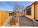 Backyard featuring a storage shed, rock landscaping and a wooden fence, offering privacy at 5448 S Swadley Ct, Littleton, CO 80127