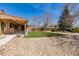 Well-maintained backyard featuring a lush lawn and manicured landscaping at 5448 S Swadley Ct, Littleton, CO 80127