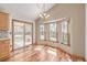 Breakfast nook area features windows and a sliding glass door providing backyard access at 5448 S Swadley Ct, Littleton, CO 80127
