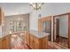 A kitchen with granite countertops, wood cabinets, stainless steel appliances and hardwood floors at 5448 S Swadley Ct, Littleton, CO 80127