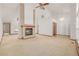 Expansive living area boasts a fireplace, high ceilings, and an abundance of natural light at 5448 S Swadley Ct, Littleton, CO 80127