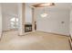 Open-concept living area featuring a fireplace, skylight, and lots of natural light at 5448 S Swadley Ct, Littleton, CO 80127
