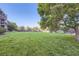 Well-maintained backyard and mature landscaping with privacy fence at 8450 Decatur St # 97, Westminster, CO 80031