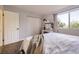 Calm bedroom highlighting natural light, built-in vanity, and closet with bi-fold doors at 8450 Decatur St # 97, Westminster, CO 80031