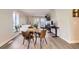 Cozy dining area showcasing a round table, modern chairs, and natural light at 8450 Decatur St # 97, Westminster, CO 80031