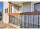 Close-up shot of front door and porch area with metal railing and muted-brown accents at 8450 Decatur St # 97, Westminster, CO 80031