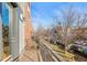 Spacious balcony with metal railing and view of the street with parked cars below at 2801 W 23Rd Ave, Denver, CO 80211