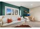 Finished basement includes a couch, desk, and plenty of natural light at 2801 W 23Rd Ave, Denver, CO 80211