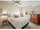 This cozy bedroom features a bright window, an accent wall, and stylish modern decor at 2801 W 23Rd Ave, Denver, CO 80211
