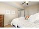 Bright bedroom features neutral walls, ceiling fan, and closet space at 2801 W 23Rd Ave, Denver, CO 80211