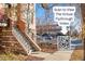 Exterior view showcasing the brickwork and stairway access to the residences at 2801 W 23Rd Ave, Denver, CO 80211