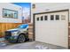 Attached one car garage in alley with grey truck parked out front at 2801 W 23Rd Ave, Denver, CO 80211