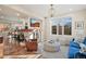 Open living room featuring a fireplace, comfortable seating, and open access to the kitchen at 2801 W 23Rd Ave, Denver, CO 80211