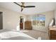 Airy main bedroom with a large window, dresser, and ensuite bathroom access, great natural light at 2801 W 23Rd Ave, Denver, CO 80211