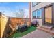 Cozy patio with seating around a fire pit and a covered grill, perfect for outdoor entertaining at 2801 W 23Rd Ave, Denver, CO 80211