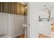 Charming powder room featuring a pedestal sink, decorative wallpaper, and hardwood floors at 2801 W 23Rd Ave, Denver, CO 80211