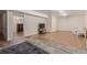 Spacious basement with wood-style flooring and view into other room at 9400 W Burgundy Ave, Littleton, CO 80123
