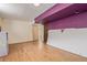 Spacious unfinished basement with laminate wood flooring and neutral paint at 9400 W Burgundy Ave, Littleton, CO 80123