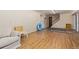 Unfinished basement with laminate floors and white walls offers potential for customization at 9400 W Burgundy Ave, Littleton, CO 80123