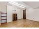 Laminate wood flooring in unfinished basement with white walls at 9400 W Burgundy Ave, Littleton, CO 80123