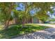 Charming two-story home with a well-maintained lawn, mature trees, and a two-car garage, exuding curb appeal at 9400 W Burgundy Ave, Littleton, CO 80123