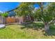 This charming home features a lush front yard, a brick facade, and a well-manicured garden at 9400 W Burgundy Ave, Littleton, CO 80123