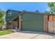 Two-story brick home with a spacious two-car garage and well-maintained landscaping, providing ample parking at 9400 W Burgundy Ave, Littleton, CO 80123