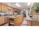 Bright kitchen with an island, granite countertops, stainless steel appliances, and tile flooring at 9400 W Burgundy Ave, Littleton, CO 80123