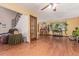 Inviting living room with hardwood floors, a ceiling fan, and large windows, creating a comfortable atmosphere at 9400 W Burgundy Ave, Littleton, CO 80123
