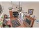 Spacious living room with fireplace and doors to the outside at 9400 W Burgundy Ave, Littleton, CO 80123