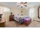 Cozy main bedroom with ceiling fan and comfortable furnishings at 9400 W Burgundy Ave, Littleton, CO 80123