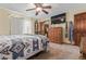 Main bedroom with ceiling fan and ample storage space at 9400 W Burgundy Ave, Littleton, CO 80123