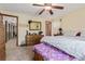 Comfortable bedroom with ceiling fan and wood furniture at 9400 W Burgundy Ave, Littleton, CO 80123