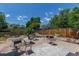 Outdoor patio with seating, table and chairs offers ample space for relaxing at 9400 W Burgundy Ave, Littleton, CO 80123