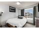 Bright bedroom with white walls, featuring a large window for ample natural light at 5408 E Briarwood Cir, Centennial, CO 80122